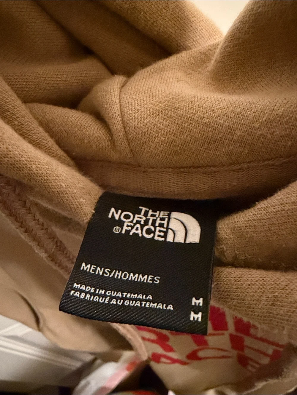 The North Face Men's Tan Hoodie with Red Logo Graphic